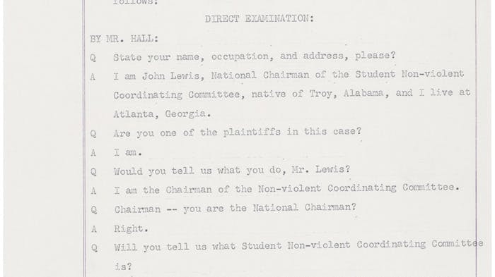 A scanned page (numbered 288) from a court document showing the beginning of testimony by John Lewis, a civil rights leader. The page shows a question-and-answer format where a lawyer named Mr. Hall asks Lewis to introduce himself. Lewis explains that he is the National Chairman of the Student Non-violent Coordinating Committee (SNCC), that he is originally from Troy, Alabama, and lives in Atlanta, Georgia. He also confirms he is one of the plaintiffs — meaning one of the people who brought the case to court. At the bottom of the page, a judge asks Lewis to speak louder so all the lawyers in the room can hear him.