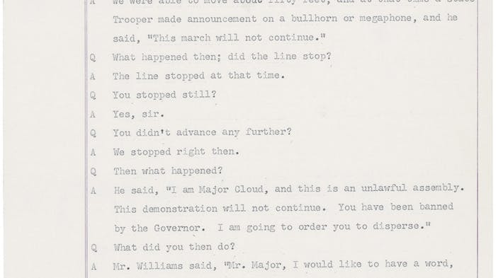 A typed page of testimony numbered page 295 from a legal proceeding, formatted in a question-and-answer style. A witness describes a civil rights march that was stopped by state troopers. An officer named Major Cloud announced through a bullhorn that the march was an unlawful assembly and ordered the crowd to leave within two minutes. When march leader Mr. Williams asked to speak with him, Major Cloud refused and ordered the troopers to move forward with their clubs raised.