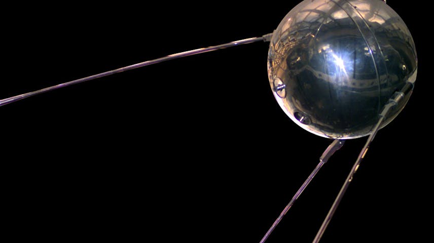 A silver metal ball with four metal antennae coming out of it that were used to send beeping radio signals back to Earth.